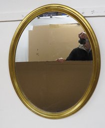 A Mid-Century Oval Gilt Framed Mirror