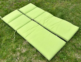 A Pair Of Green Sunbrella Lounge Chair Cushions