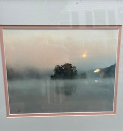 A Print Of A Photograph In A Silver Leaf Frame