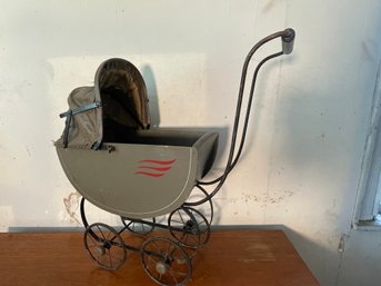 AN EARLY DOLL CARRIAGE