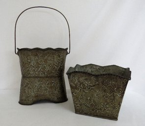 A Pairing Of Rustic Floral Embossed Metal Plant Vessels