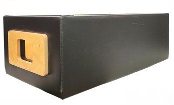 A Leather Clad Box With Cut Our Handle