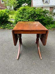 An Antique Cherry Extending Double Pedestal Dining Room Table