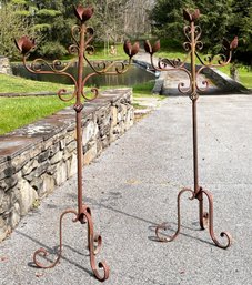 A Pair Of Antique Standing Candelabra With Petal Form Accents