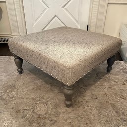 A Modern Style Ottoman With Nail Head Trim