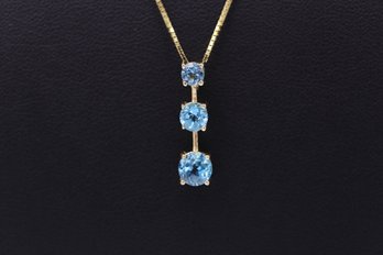 Graduated Round Aquamarine Pendant Necklace In 14k Yellow Gold