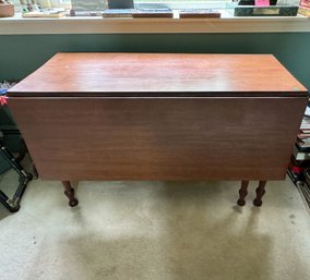 A MAPLE DROP LEAF TABLE