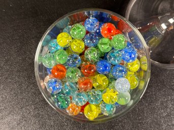 A Covered Candy Dish Full Of Beautiful Vintage Crackle Glass Marbles