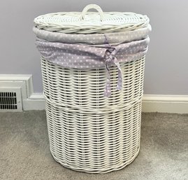 A Laundry Hamper With Linen Lining