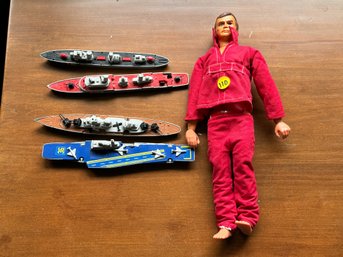 A SIX MILLION DOLLAR MAN ACTION FIGURE AND FOUR MATCHBOX SEA KING BOATS