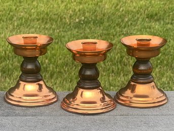 Three Coppercraft Guild Candle Holders