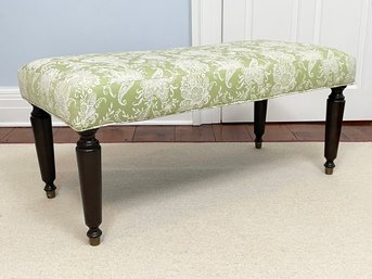 An Upholstered Bench With Turned Legs And Brass 'Feet'