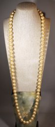 LARGE 1980S FAUX PEARL NECKLACE 36' LONG STRAND HAVING FLORAL FORM CLASP