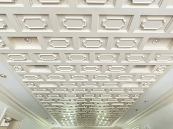 A Large Coiffured Ceiling And Associated Trim