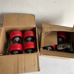 A Group Of 8 Industrial Strength EZ Roll Wheels