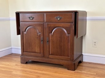 A Vintage Buffet Server In Solid Cherry With Drop-Leaf Sides By Ethan Allen