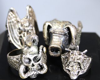 LOT FOUR SILVER PLATED MEN'S RINGS PIG, SKULL, ETC. SIZES 9 TO 11.5