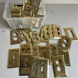A Large Assortment Of Brass Cover Plates