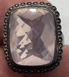 Signed Sterling Silver Ring With A Large Highly Faceted Pink Gemstone