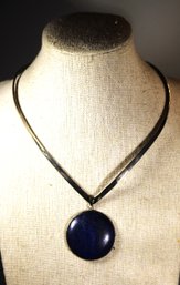 STERLING SILVER TORQUE NECKLACE HAVING LARGE LAPIS STONE PENDANT UNMARKED