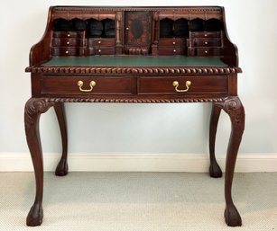 A Carved Mahogany Chippendale Writing Desk