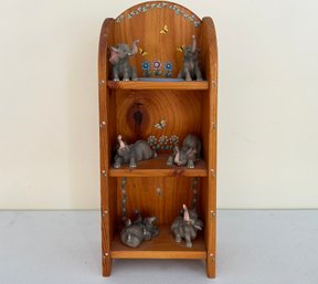 A Pine Curio Shelf And Dumbo Figurines