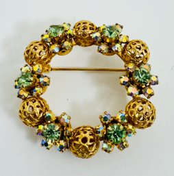 VINTAGE GOLD TONE GREEN RHINESTONE CIRCULAR BROOCH