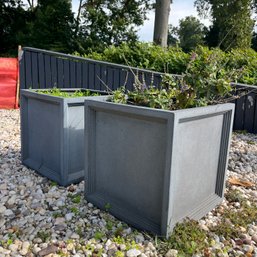 A Pair Of Resin Planters