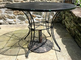 A Vintage Wrought Iron And Mesh Outdoor Dining Table By Woodard, 1960's