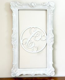 A Painted Wood Frame And Scrolled Artwork