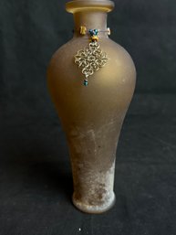 Brown Frosted Glass Vase With Filigree And Beaded Necklace On Bottle Neck