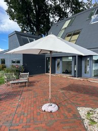 A Tuuci Canvas Umbrella And Stand