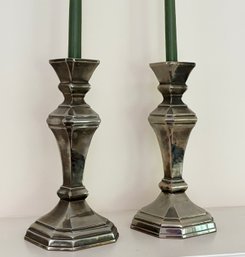A Pair Of Silver Candlesticks