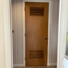 A Pair Of Solid Core Vented Wood Doors