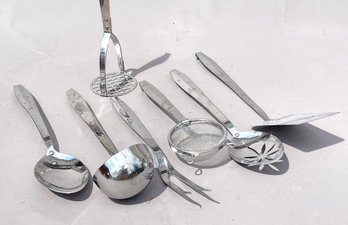 A Set Of Kitschy Mid Century Serving Utensils