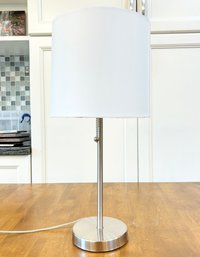 A Modern Brushed Steel Stick Lamp