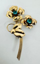 SIGNED GOLD OVER STERLING SILVER FLOWER BROOCH WITH BLUE GLASS STONES