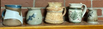 Five Pottery Pitchers