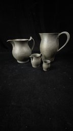 Pewter Pitchers And Cup