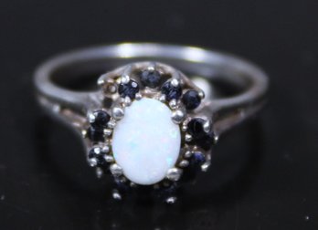 STERLING SILVER LADIES RING SIZE 8 SAPPHIRES AND PALE OPAL STONE (MISSING ONE SAPPHIRE)