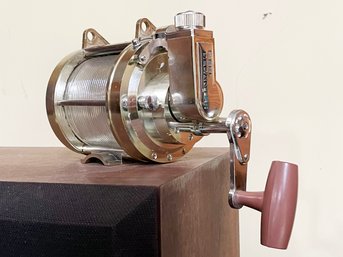 A Vintage Fishing Reel Decanter