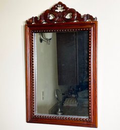 An Antique Carved Mahogany Mirror