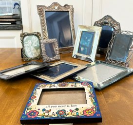 A Collection Of Small Photo Frames