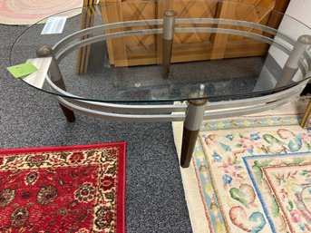 Modern Glass Top Table With  Silver And Wood Legs  Oval Shaped