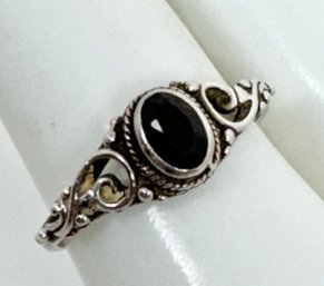 PRETTY STERLING SILVER GARNET RING