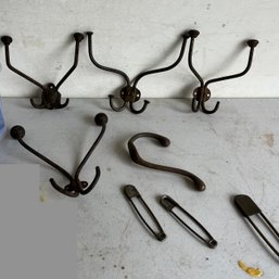 A Set Of Antique Hat Hooks And Large Safety Pins