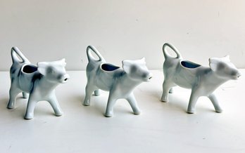 A Trio Of Cow Form Porcelain Creamers, Apilco France