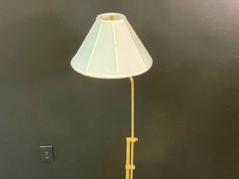 A Floor Lamp In Brass With Adjustable Height