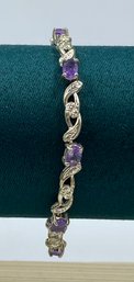 Silvertone Ladies Bracelet W/ Purple Stones