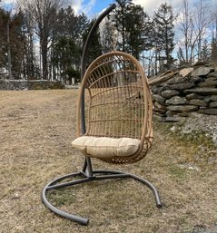 A Resin Hanging 'Rattan' Chair With Stand And Cushion